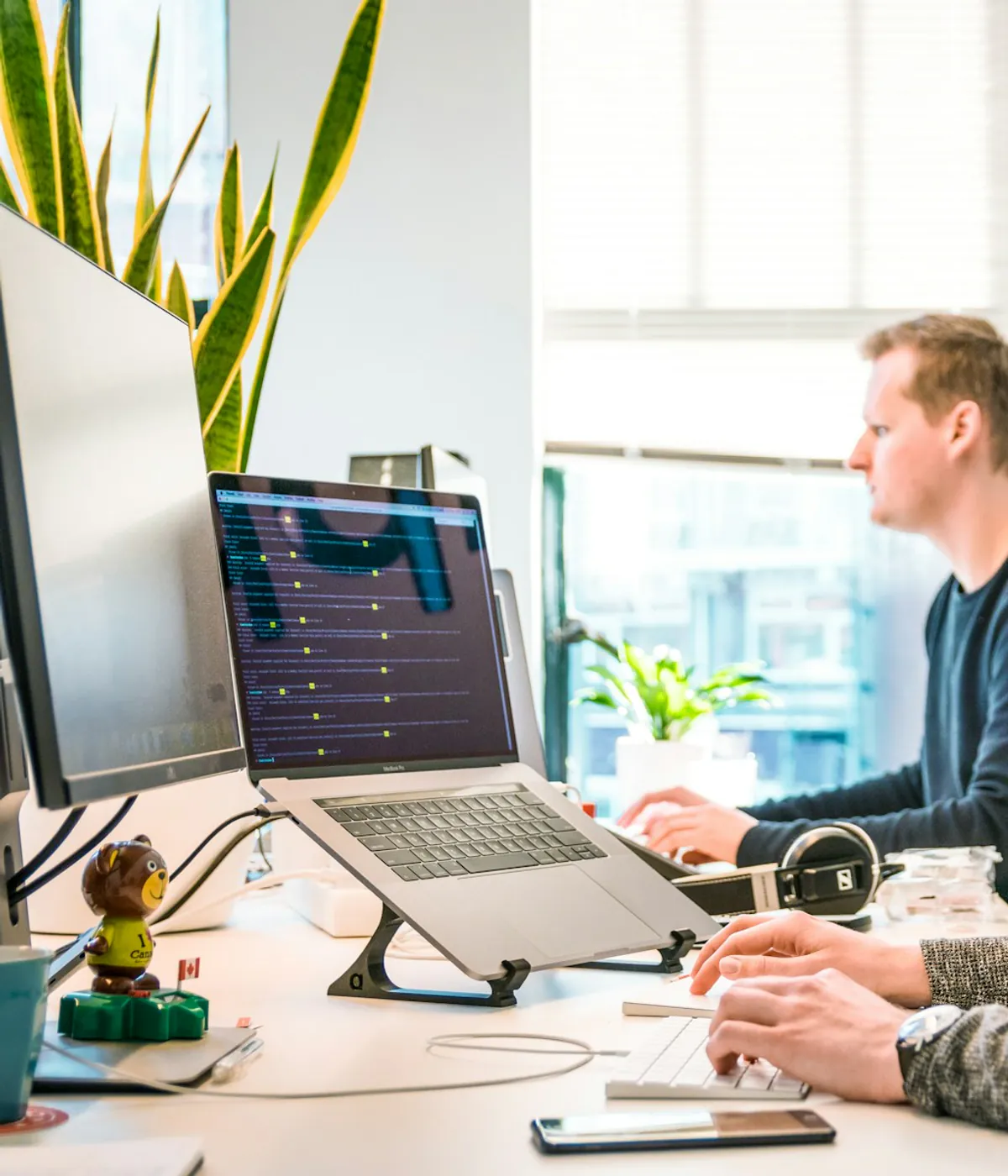Development team discussing commerce platform options in an office