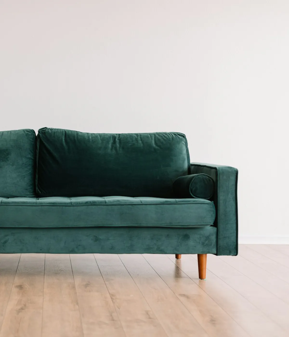 Modern green sofa photographed for a furniture catalog