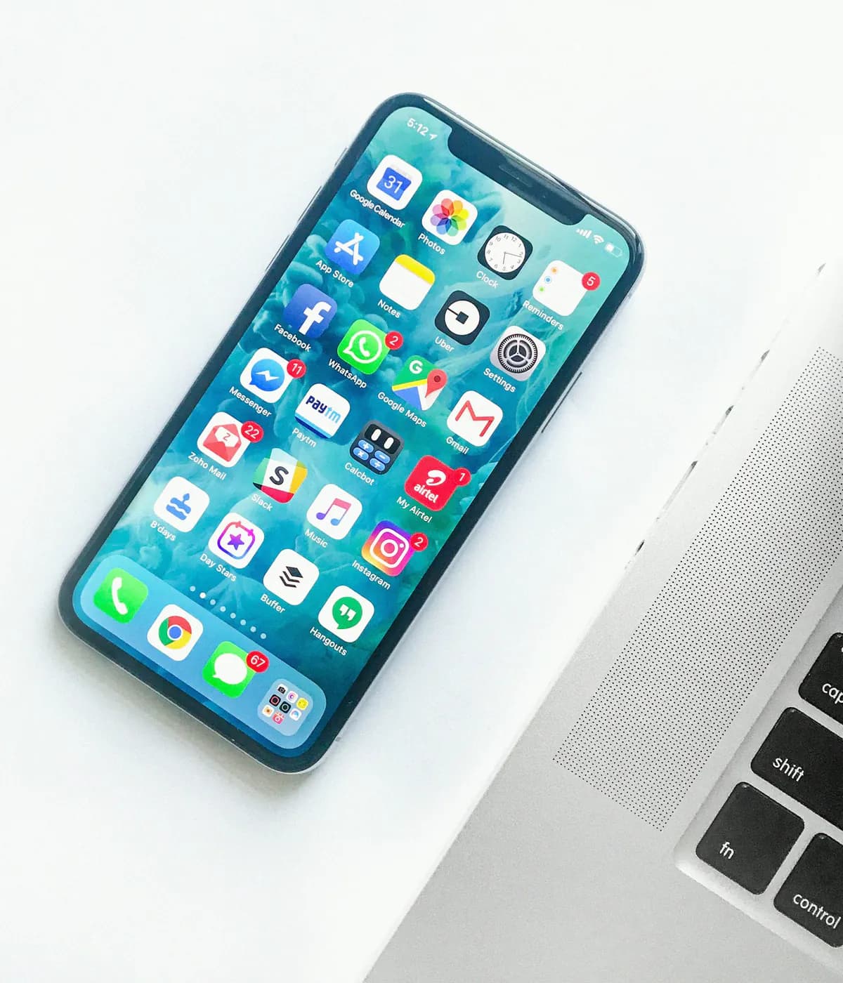 Smartphone beside a laptop representing a mobile-first shopping experience