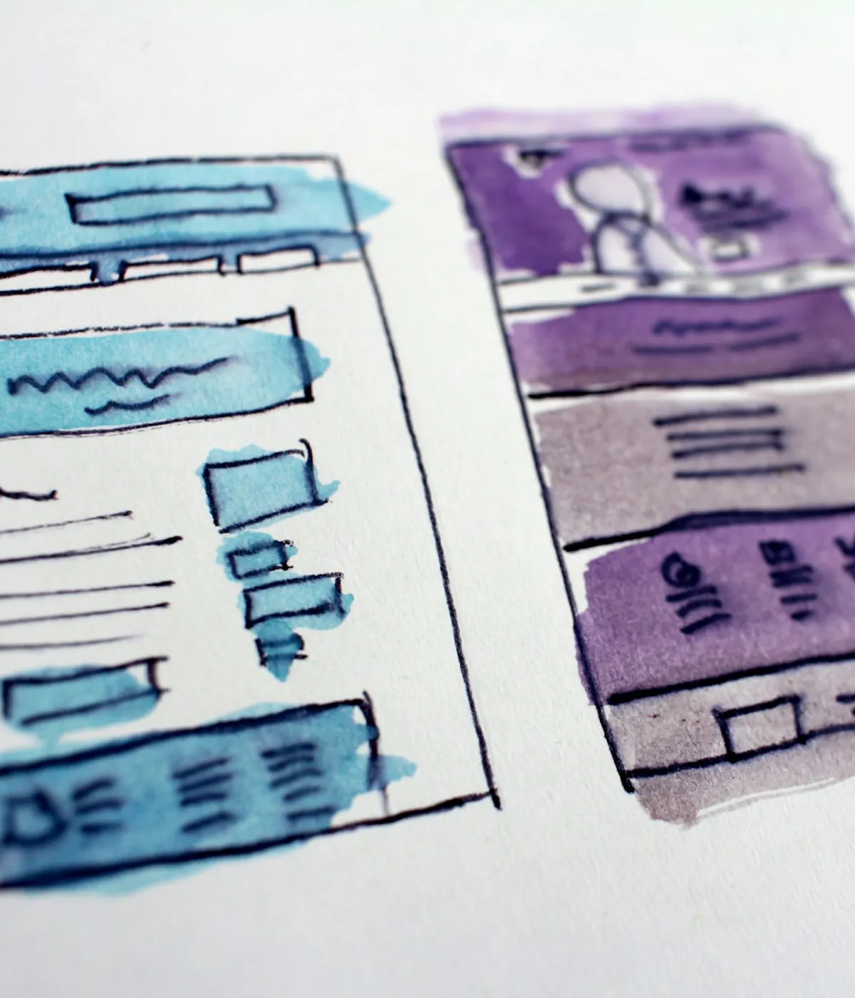 Designer sketching and reviewing an ecommerce interface redesign