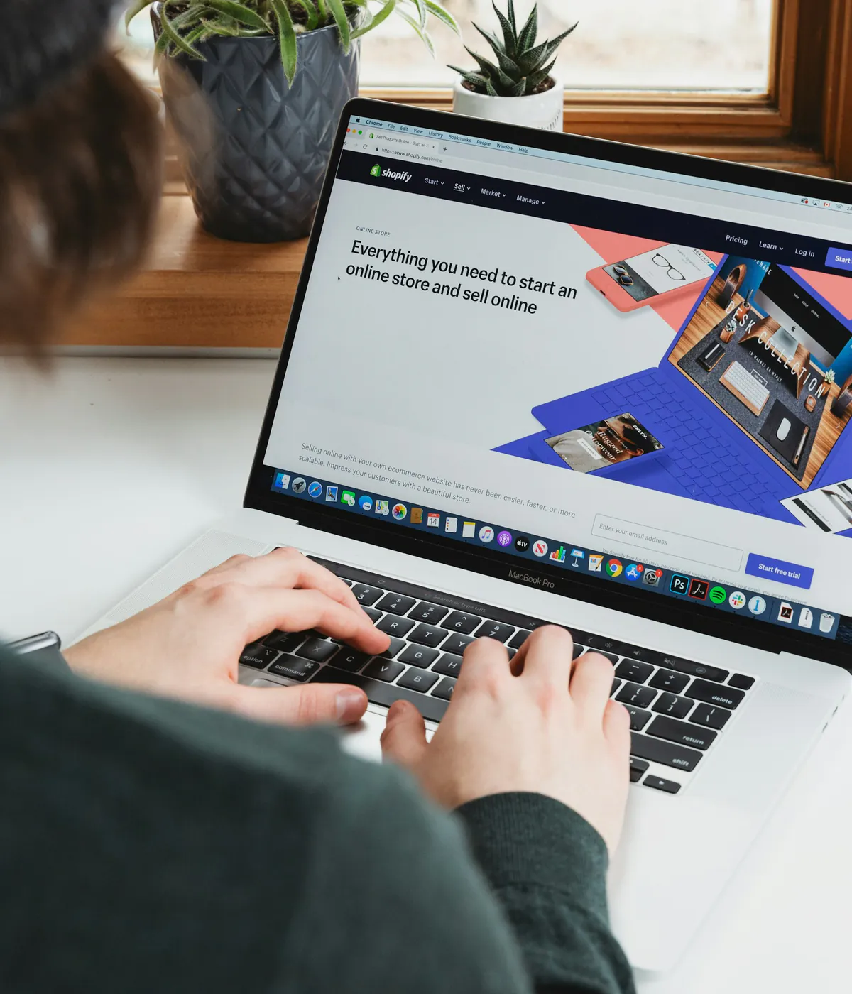 Developer rebuilding an ecommerce storefront on a laptop